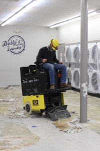 Houck working on new floors in Dolly's Laundromat